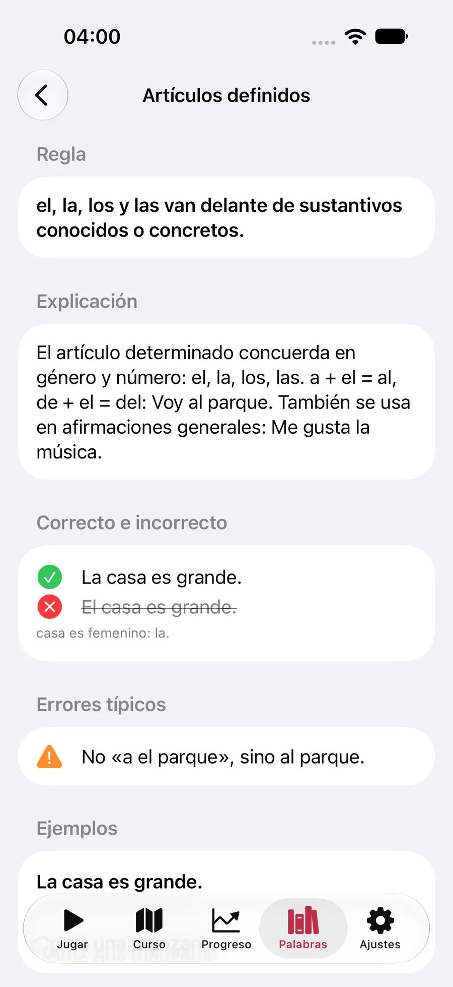 Explicación gramatical de Leavo sobre artículos definidos con regla, frase correcta e incorrecta, error típico y ejemplo